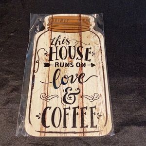 Wooden mason jar shaped sign;this house runs in coffee. Includes twine string.